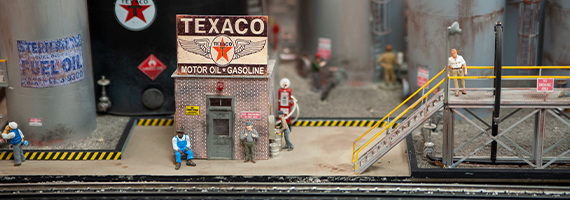 deadhead railways - o gauge trains for sale - texaco motor oil gasoline building, men waiting outside