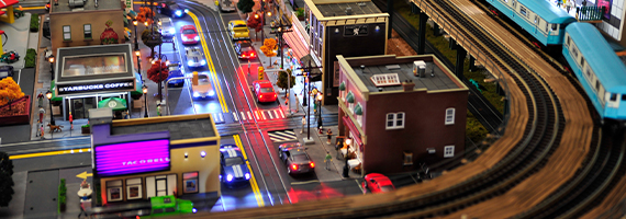 deadhead railways - model railway model trains - modern city layout elevated blue train over city