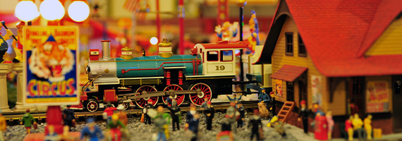 deadhead railways - model trains model train scales - train pulling into train station with circus behind