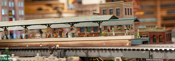 deadhead railways - model train tables - people waiting at elevated subway/train station